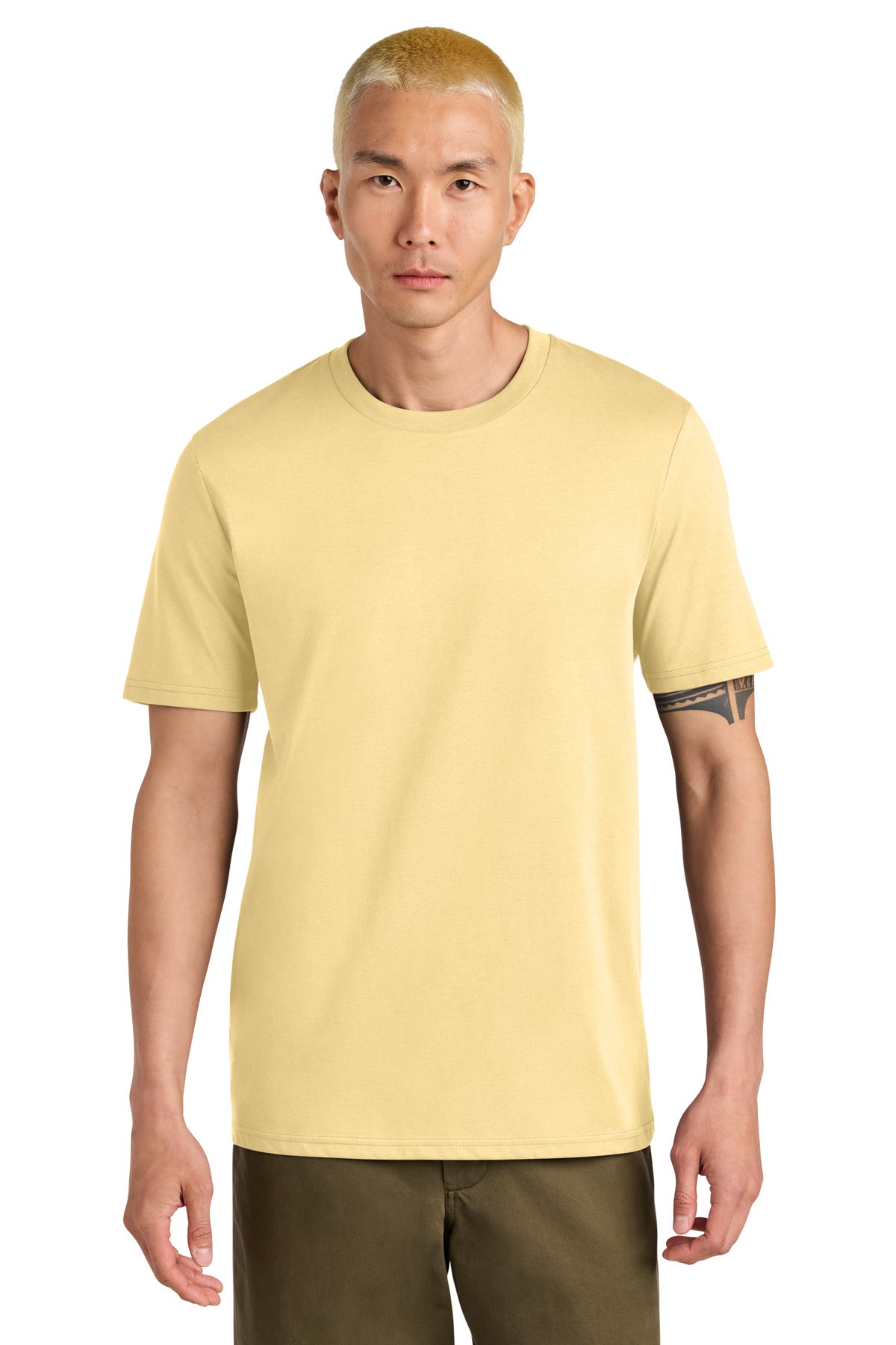 Man wearing a light yellow t-shirt with a brand logo on a white background
