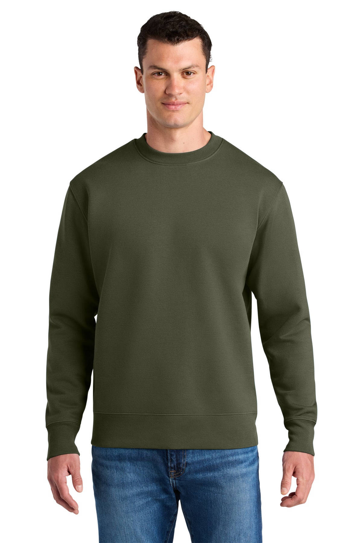 Man wearing an olive green sweatshirt and blue jeans on a white background