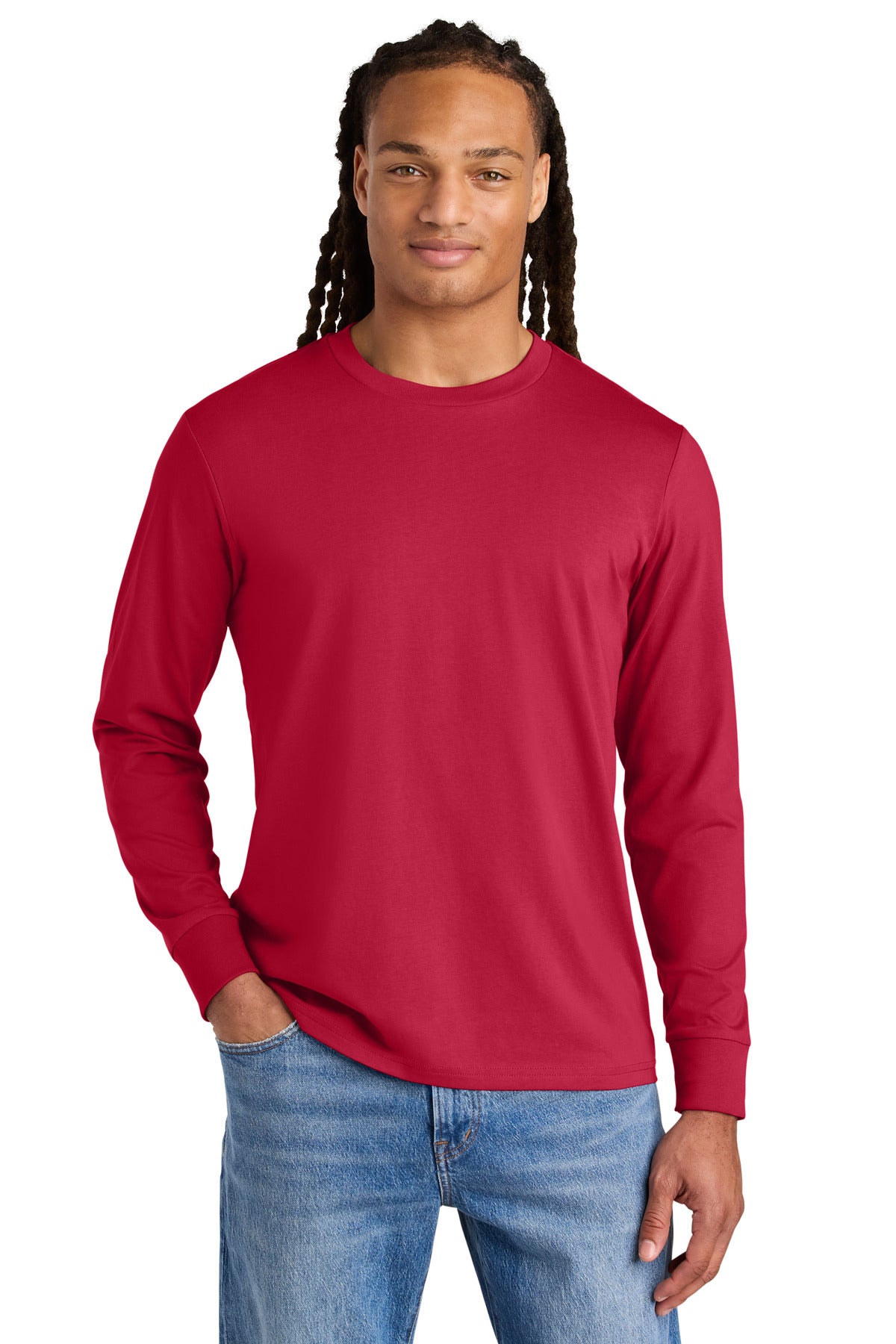 Man wearing a red long-sleeve shirt and blue jeans on a white background
