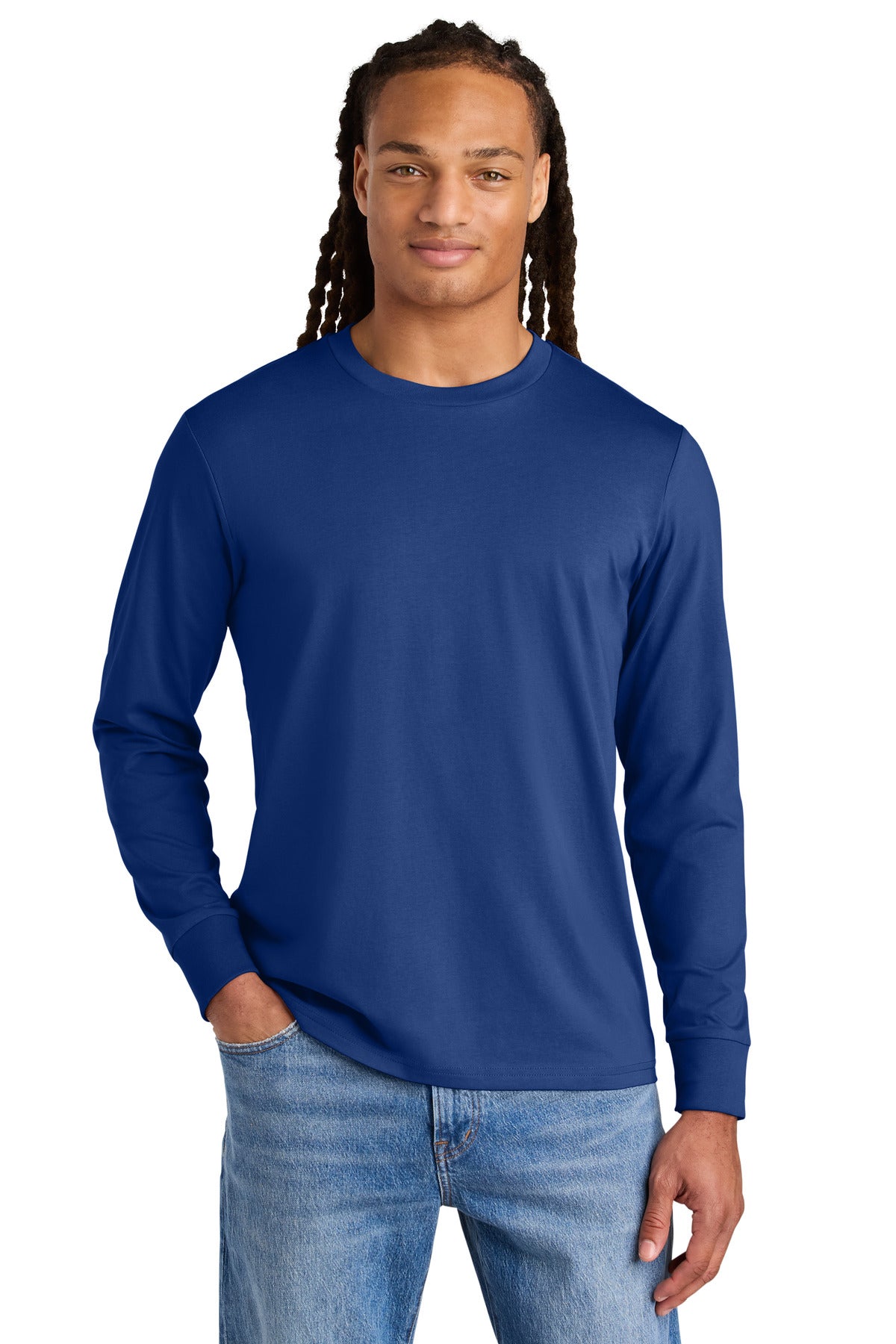 Man wearing a blue long-sleeve shirt and jeans on a white background