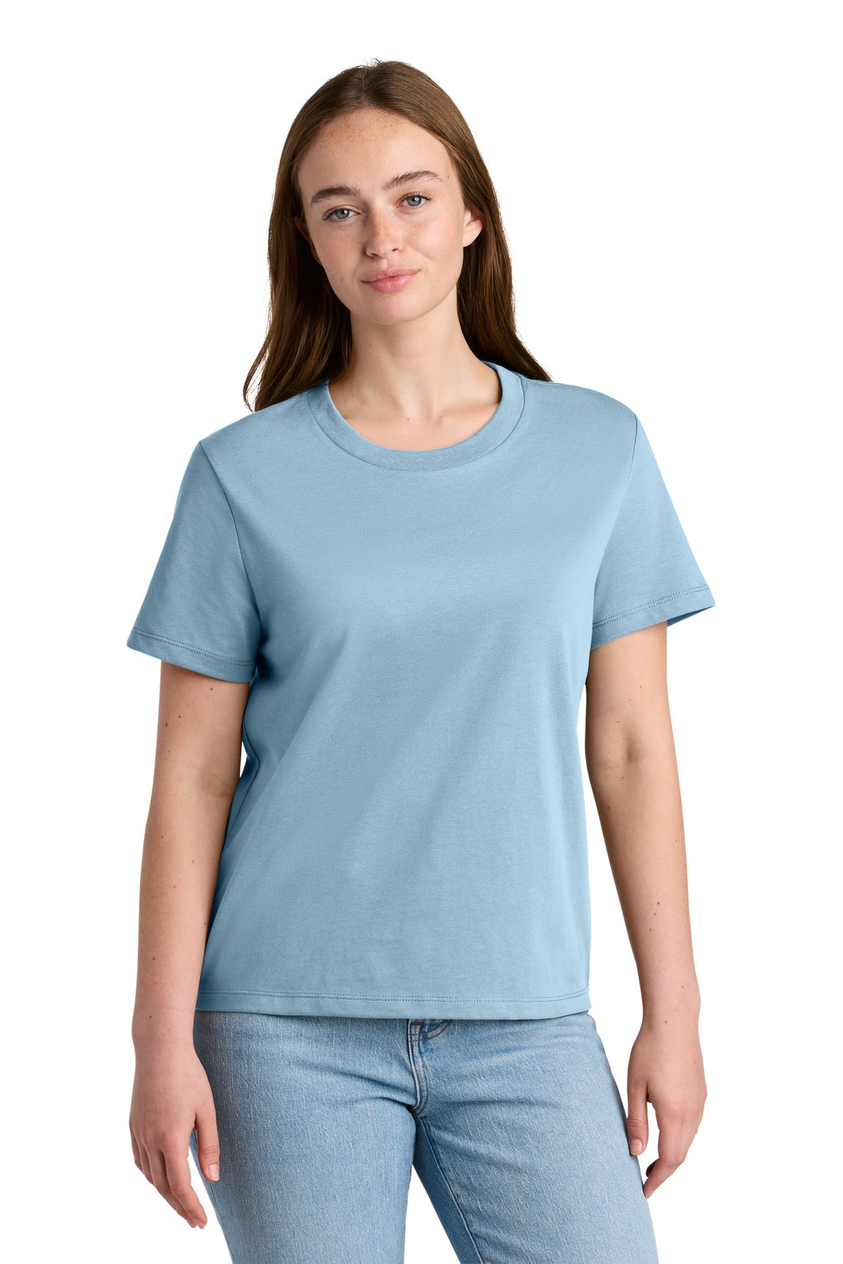 Woman wearing a light blue t-shirt and jeans on a white background
