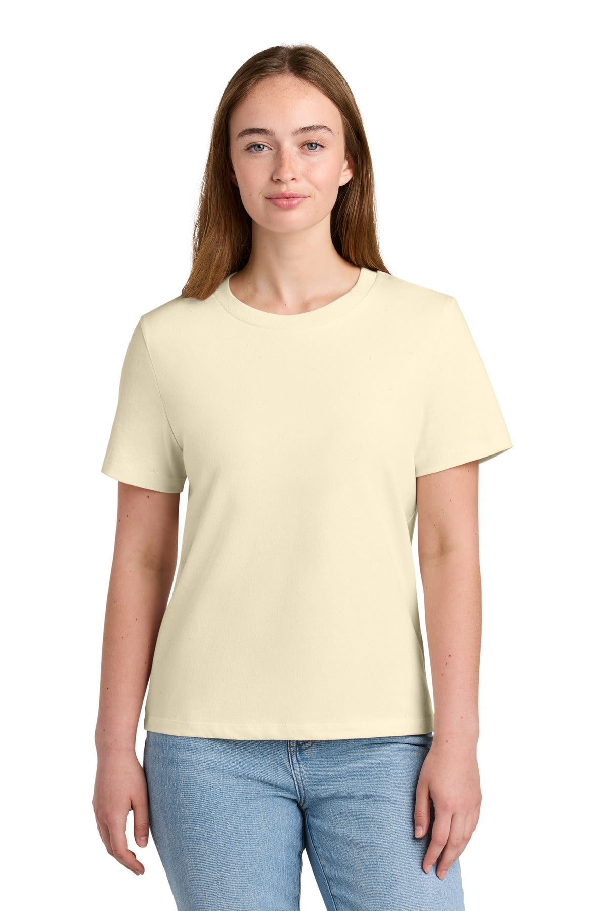 Woman wearing a light yellow t-shirt and blue jeans on a white background