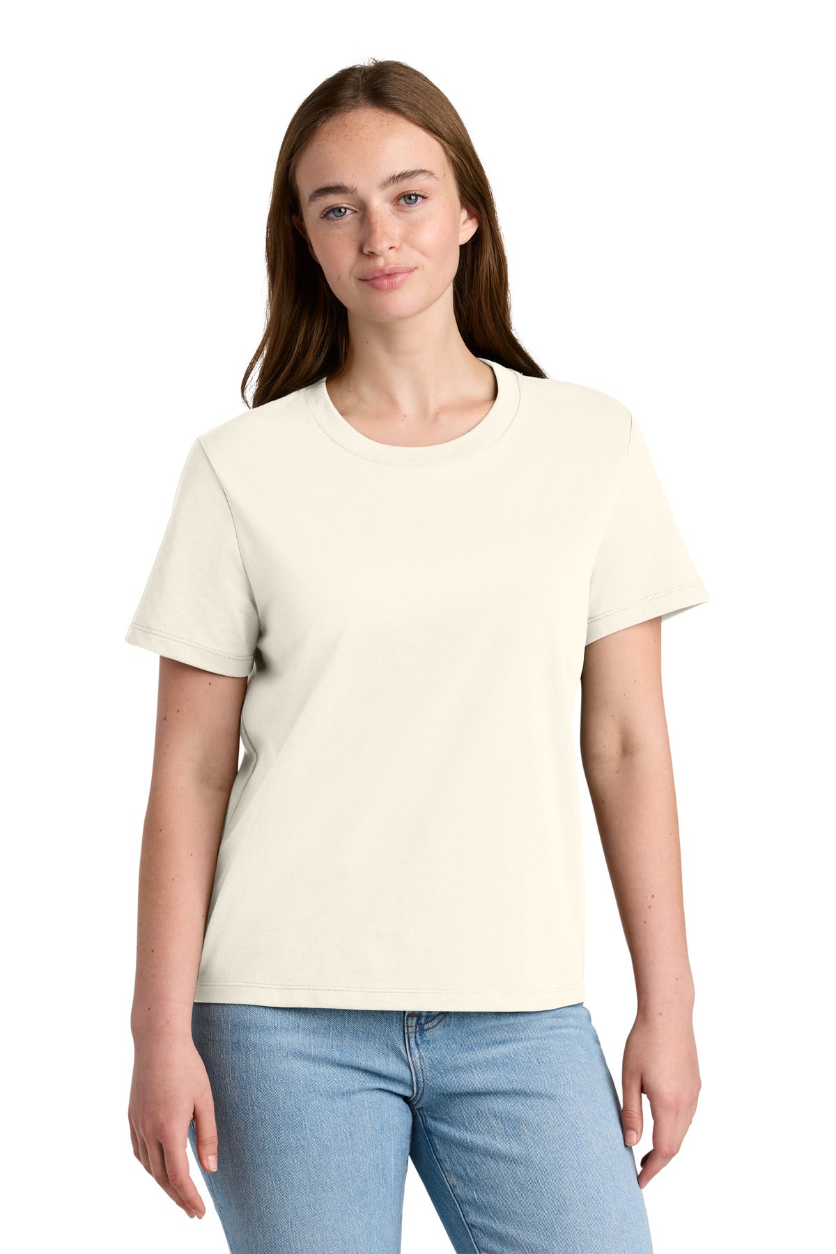 Woman wearing a plain cream t-shirt and light blue jeans on a white background