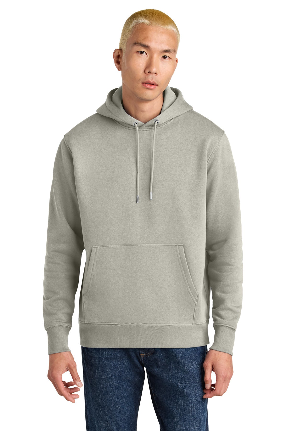 Person wearing a light gray hoodie and blue jeans on a white background