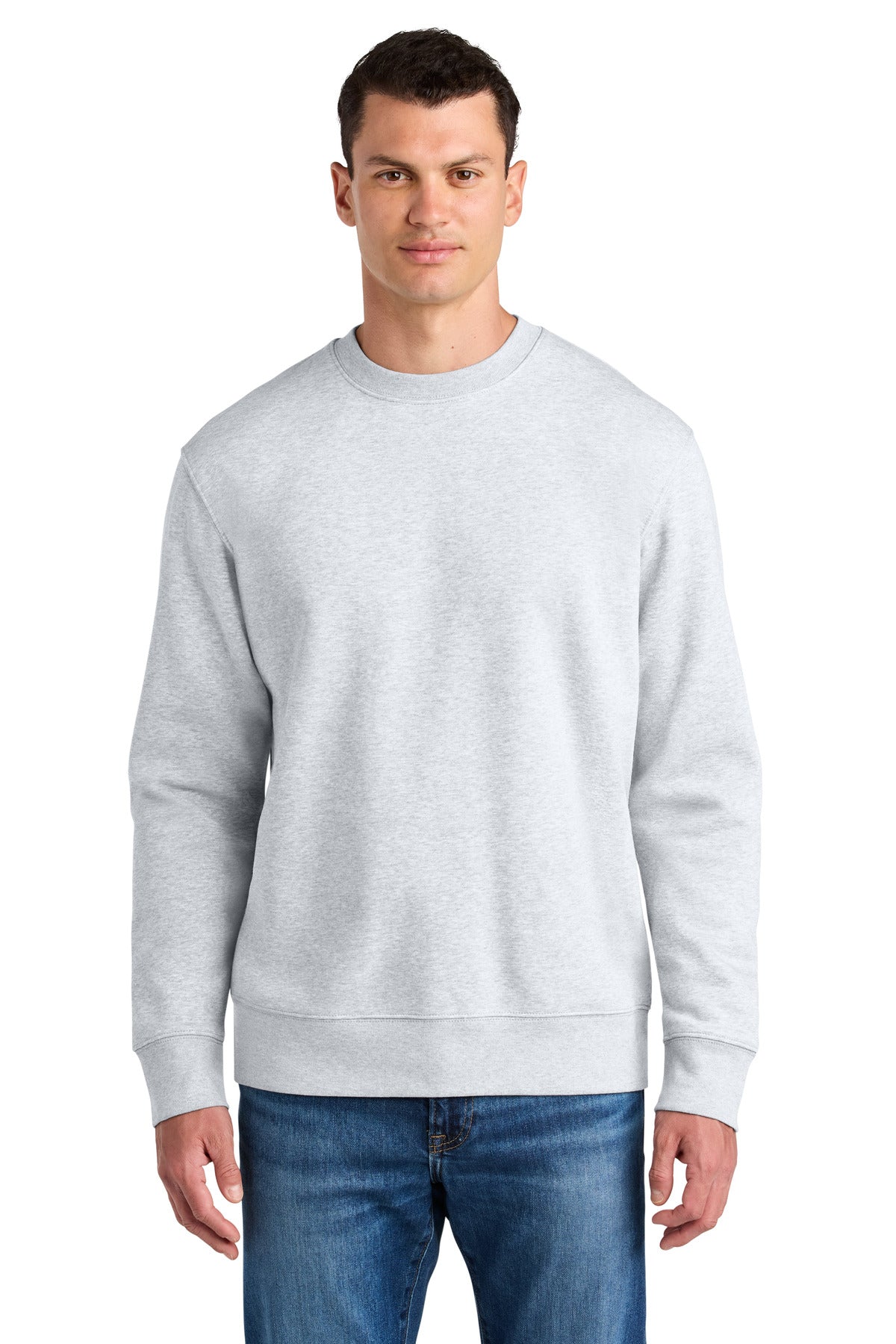 Man wearing a gray sweatshirt and blue jeans on a white background