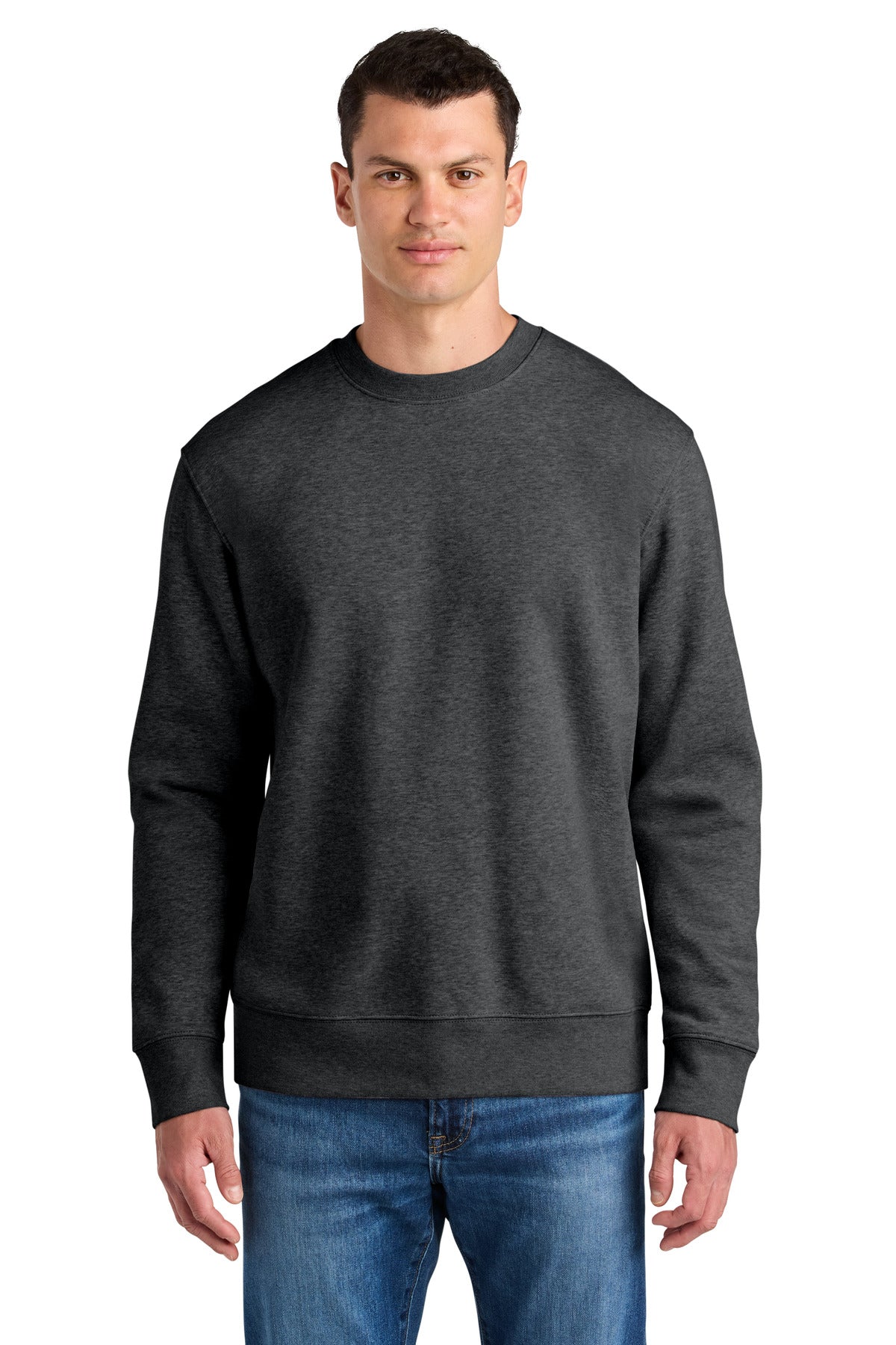 Man wearing a dark gray sweatshirt and blue jeans on a white background