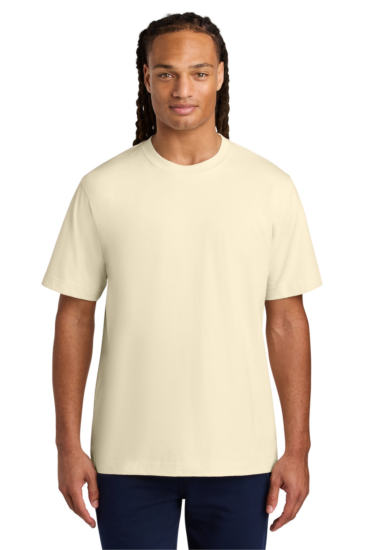 Man wearing a plain beige t-shirt on a white background